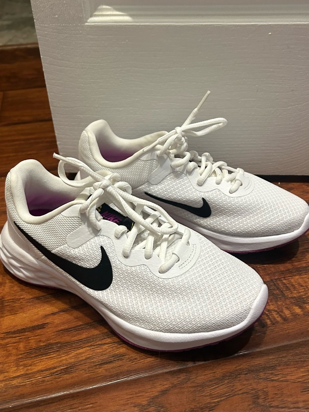 Nike White Running Sneakers with Black Swoosh and Purple Interior